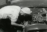 checking the engine of his street rod